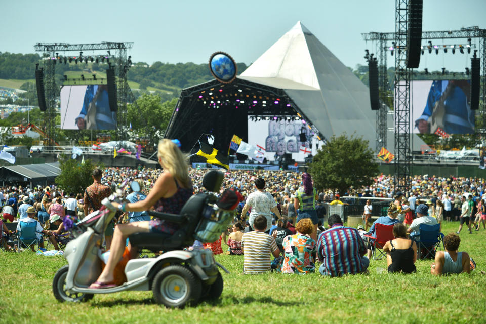 GLASTONBURY, ENGLAND - JUNE 28:  Festival goers enjoy the sunshine during day three of Glastonbury Festival at Worthy Farm, Pilton on June 28, 2019 in Glastonbury, England. The festival, founded by farmer Michael Eavis in 1970, is the largest greenfield music and performing arts festival in the world. Tickets for the festival sold out in just 36 minutes as it returns following a fallow year. (Photo by Jim Dyson/Getty Images)