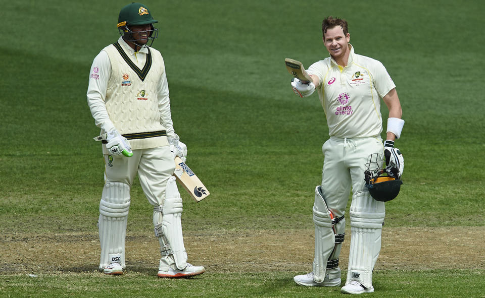 Usman Khawaja and Steve Smith, pictured here after making centuries on the second day of the third Test against South Africa.