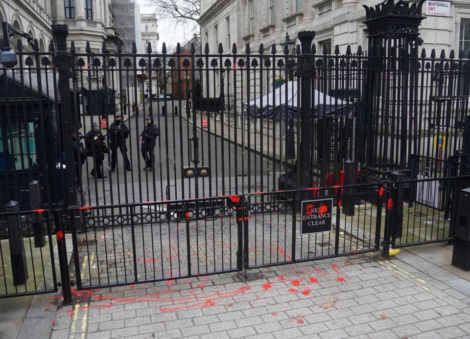 Red paint thrown on the gates of Downing Street in London (PA)