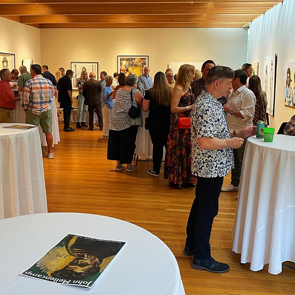 A preview reception for John Mellencamp's exhibit, "Paintings & Assemblages," was held Saturday night at the Mansfield Art Center