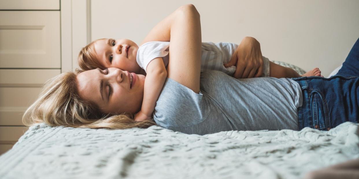 woman hugging toddler girl - preparing a toddler for a new sibling