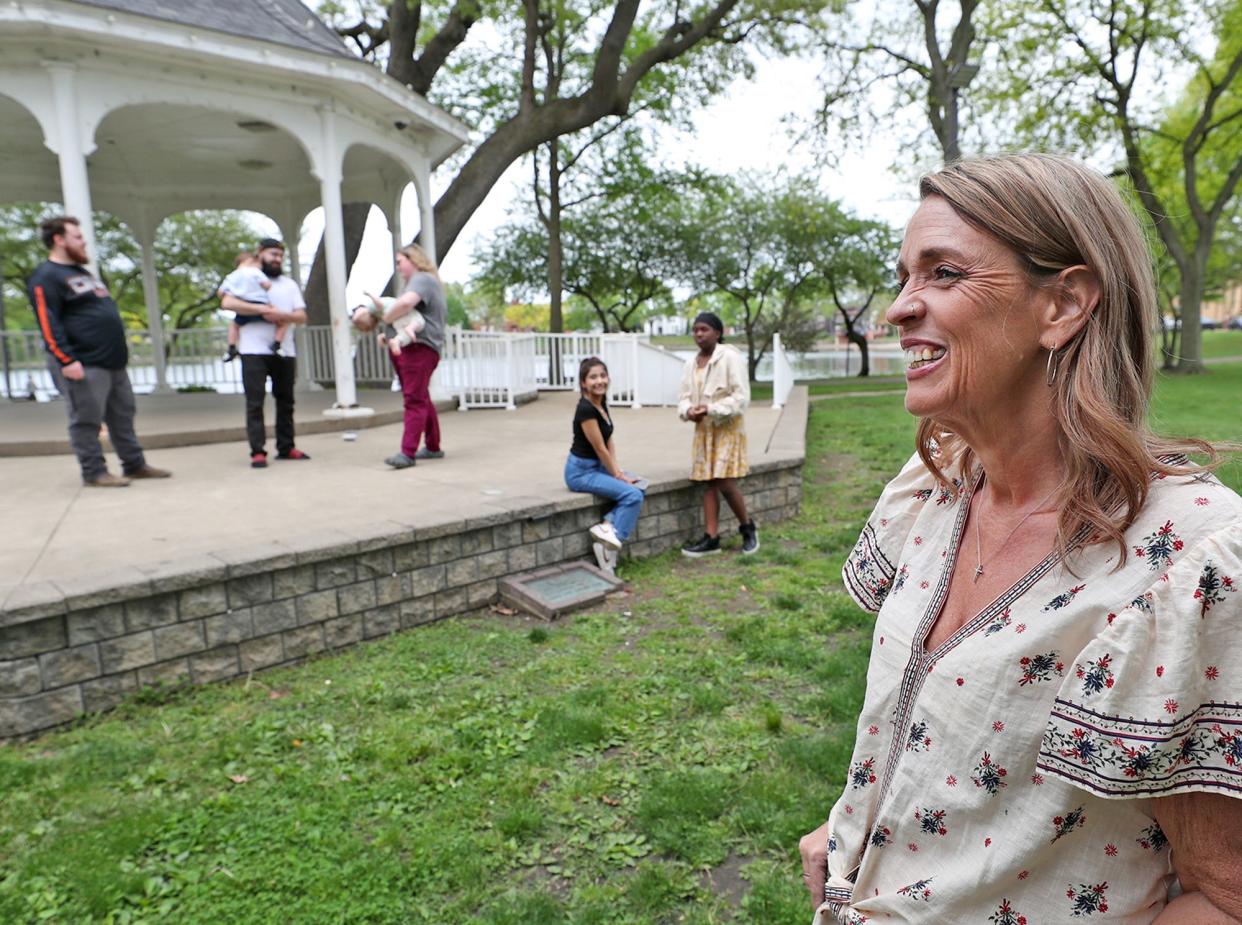 Jennifer Wokojance, right, talks about being a foster mom as some of her former foster children and adopted children gather at the gazebo at Lake Anna in Barberton.