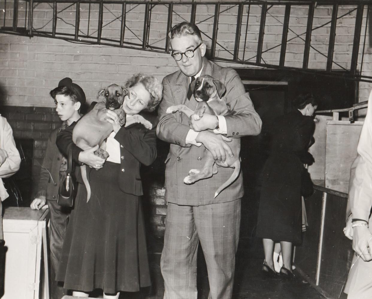 Guernsey County Common Pleas Judge Howard Faught (right) and his wife at a dog show in Cambridge. Year unknown.