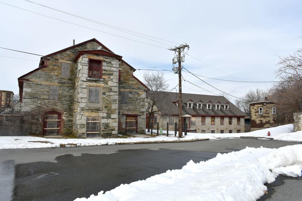 Two of the Bernon Mills buildings in Woonsocket are in very bad shape, with rotten roofs. A developer is trying to turn them into a mixed-use development, mostly apartments.