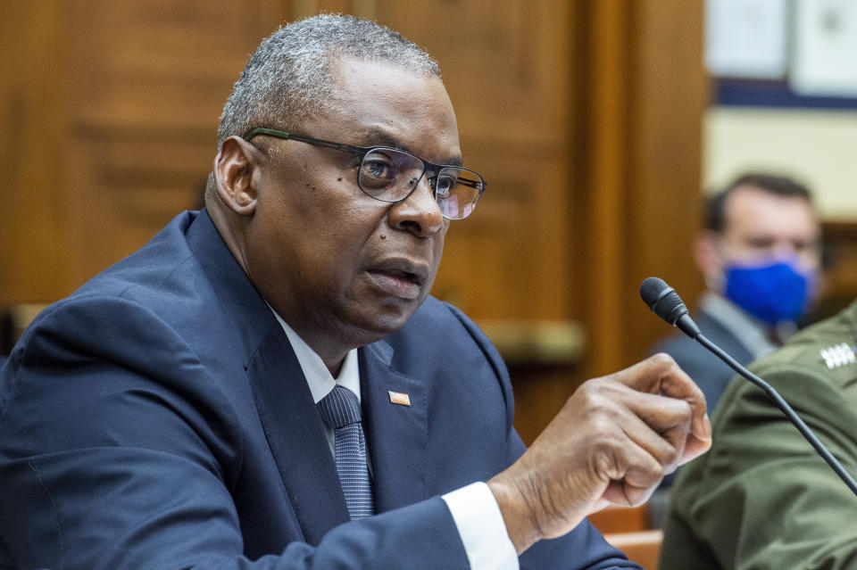 FILE - In this Sept. 29, 2021, file photo, Defense Secretary Lloyd Austin testifies before the House Armed Services Committee on Capitol Hill in Washington. A new Pentagon plan calls for incorporating the realities of a hotter, harsher Earth at every level in the U.S. military, from making worsening climate extremes a mandatory part of strategic planning to training troops how to secure their own water supplies and treat heat injury. (Rod Lamkey/Pool via AP)