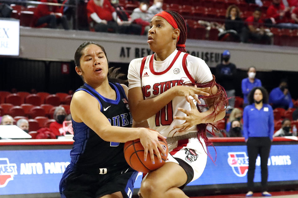 Duke Blue's Vanessa de Jesus, left, strips the ball from a driving North Carolina State's Aziaha James (10) during the second half of an NCAA college basketball game, Sunday, Jan. 16, 2022, in Raleigh, N.C. (AP Photo/Karl B. DeBlaker)