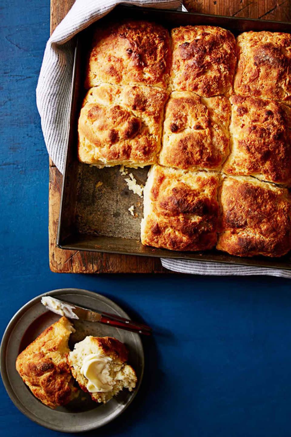 <p>You can never go wrong with this classic Southern staple. </p><p><strong><em><a href="https://www.womansday.com/food-recipes/food-drinks/recipes/a39558/quick-n-easy-southern-biscuits-recipe-ghk0714/" rel="nofollow noopener" target="_blank" data-ylk="slk:Get the Quick and Easy Southern Biscuits recipe.;elm:context_link;itc:0;sec:content-canvas" class="link ">Get the Quick and Easy Southern Biscuits recipe.</a></em></strong> </p>