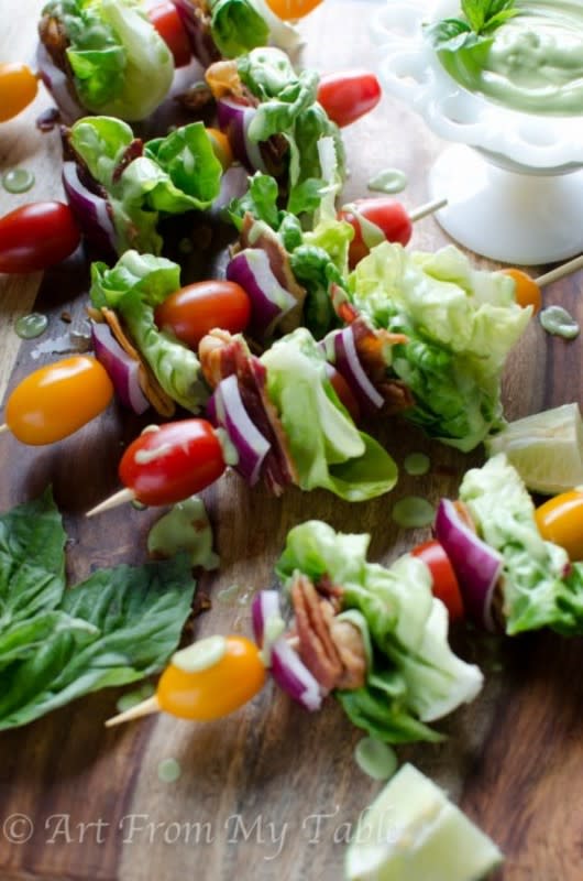 <p>Art from my Table</p><p>Creamy homemade avocado dressing drizzled over crisp butter lettuce, salty bacon, and sweet juicy grape tomatoes all on a skewer for the perfect party appetizer.</p><p><strong>Get the Recipe: </strong><a href="https://www.artfrommytable.com/blt-salad-stick/" rel="nofollow noopener" target="_blank" data-ylk="slk:BLT on a Stick;elm:context_link;itc:0;sec:content-canvas" class="link ">BLT on a Stick</a></p>