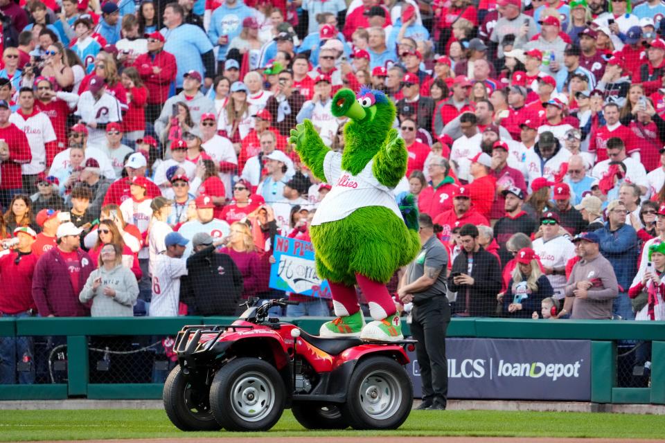 Philadelphia Phillies mascot Phillie Phanatic cheers with fans before Game 6 of the NLCS at Citizens Bank Park on Oct. 23, 2023, in Philadelphia, PA. The Arizona Diamondbacks won Game 6 of the NLCS against the Philadelphia Phillies, 5-1.