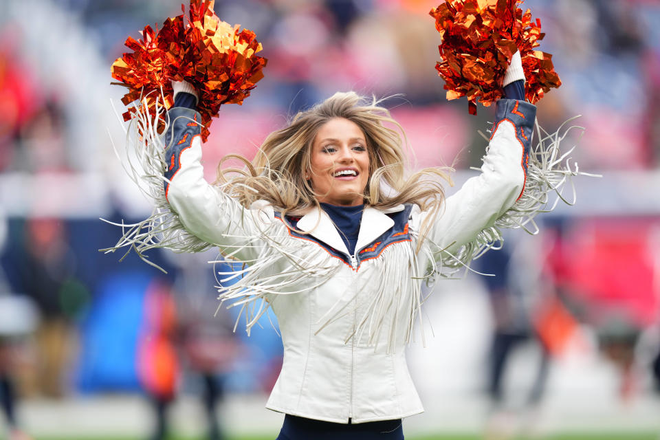 Oct 29, 2023; Denver, Colorado, USA; Denver Broncos cheerleader Berkleigh Wright performs in the first quarter against the Denver Broncos at Empower Field at Mile High. Mandatory Credit: Ron Chenoy-USA TODAY Sports