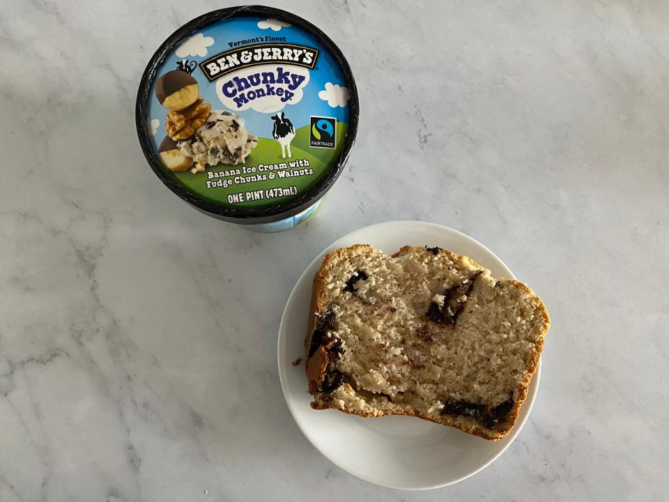 chunky monkey ben and jerrys pint next to a plated slice of the ice cream bread, all on a white countertop