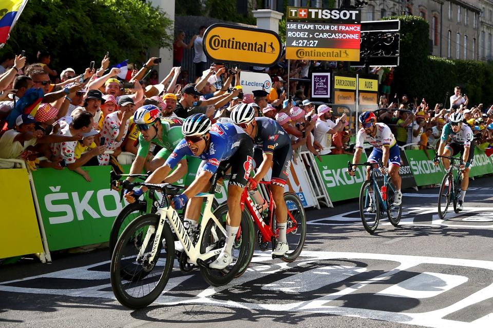 Jasper Philipsen throws his bike