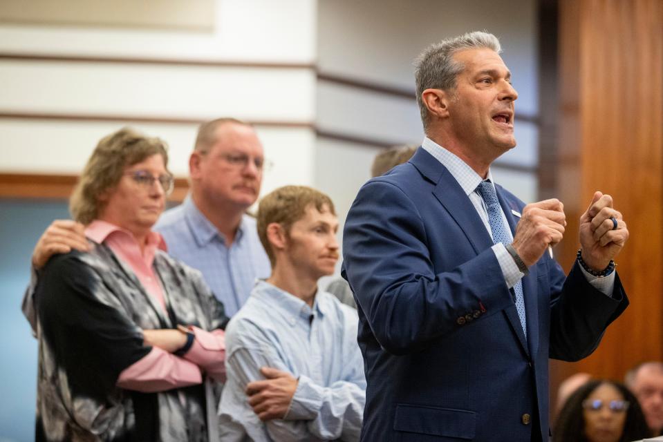 Attorney Eric Bland, right, standing with members of the Satterfield family, addresses the court during Alex Murdaugh's sentencing for stealing from 18 clients, Tuesday, Nov. 28, 2023, at the Beaufort County Courthouse in Beaufort, S.C. (Andrew J. Whitaker/The Post And Courier via AP, Pool)