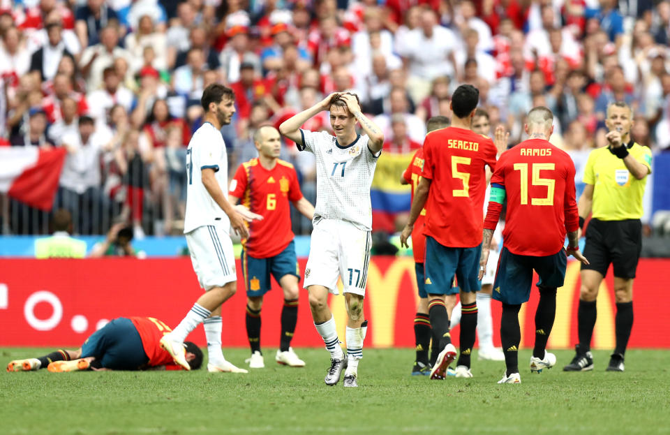 <p>Aleksandr Golovin reacts after the referee ruled he fouled Spain’s Isco </p>