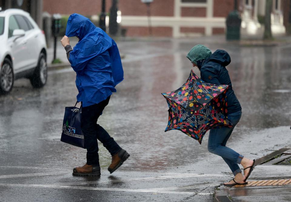 People walk in the rain and wind from Post-Tropical Cyclone Lee on September 16, 2023 in Bar Harbor, Maine. Formerly a hurricane, the storm was downgraded, but forecasters say it will remain large and dangerous. (Photo by Joe Raedle/Getty Images)