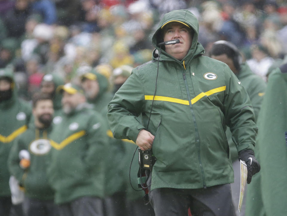 Green Bay Packers' Head Coach Mike McCarthy watches a replay on the scoreboard during the first half of an NFL football game against the Arizona Cardinals Sunday, Dec. 2, 2018, in Green Bay, Wis. (AP Photo/Mike Roemer)