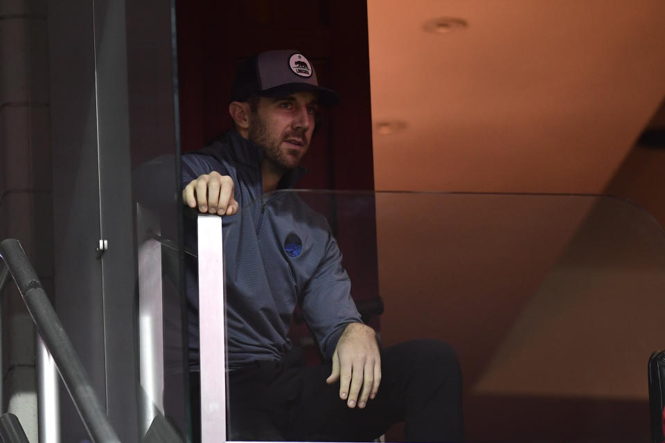 Washington Redskins quarterback Alex Smith sits in the stands during the game between the Washington Wizards and the Detroit Pistons at Capital One Arena. Mandatory Credit: Tommy Gilligan-USA TODAY Sports