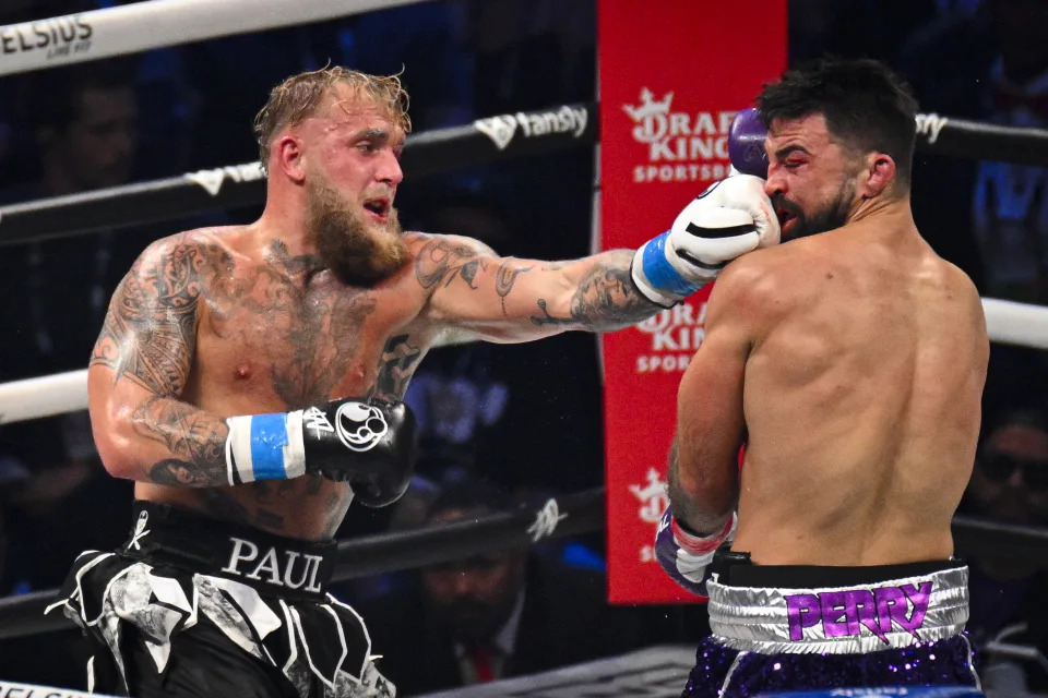 TAMPA, FLORIDA - JULY 20: Jake Paul (L) punches Mike Perry (R) during their cruiserweight fight at Amalie Arena on July 20, 2024 in Tampa, Florida. (Photo by Miguel J. Rodriguez Carrillo/Anadolu via Getty Images)