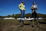 Helen Greiner, founder of CyPhy Works, and John Dodero, UPS vice president of industrial engineering, talk about the CyPhy Works drone which carried a UPS package to Children's Island off the coast of Beverly, Massachusetts. REUTERS/Brian Snyder