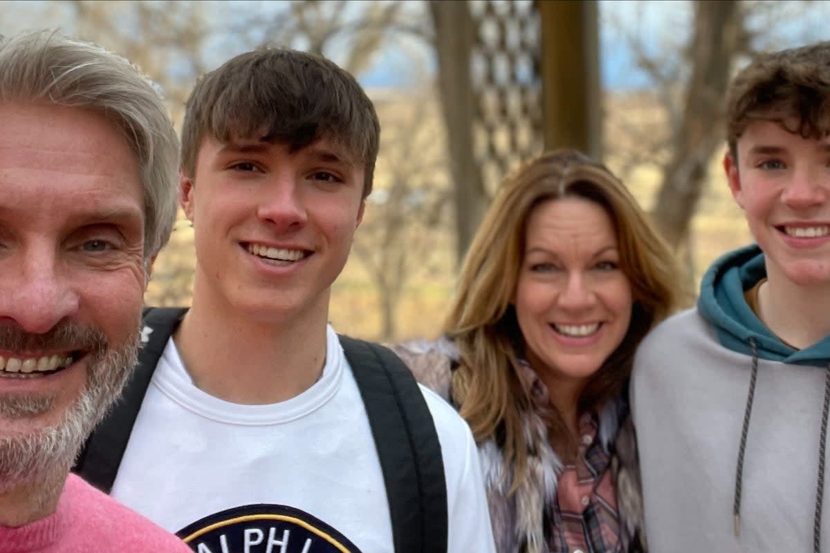 Mr Webber (second left) with his father David, mother Emma and brother Charlie Webber (PA)