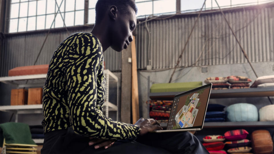 A young professional working on a Apple MacBook Air 2024