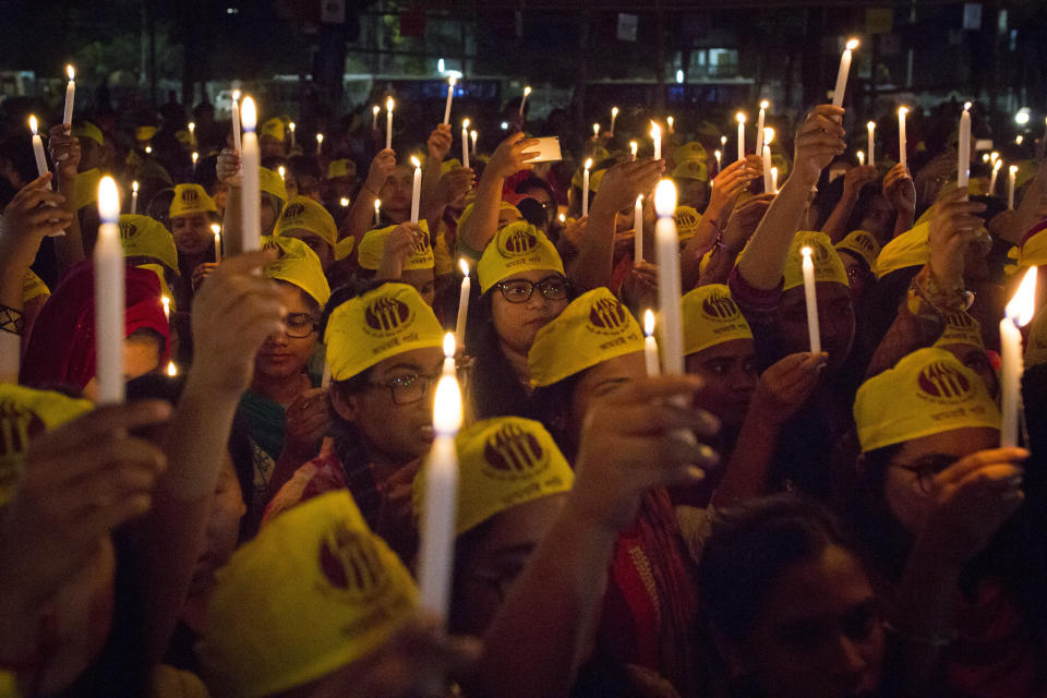 Women from all walks of life hold a candlelight vigil on the Central Shaheed Minar premises just after midnight.