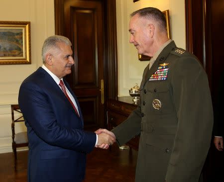 Turkish Prime Minister Binali Yildirim (L) meets with U.S. Joint Chiefs of Staff General Joseph Dunford in Ankara, Turkey, August 1, 2016. Picture taken August 1, 2016. Mustafa Aktas/Prime Minister's Press Office/Handout via REUTERS. ATTENTION EDITORS - THIS PICTURE WAS PROVIDED BY A THIRD PARTY. FOR EDITORIAL USE ONLY. NO RESALES. NO ARCHIVE.