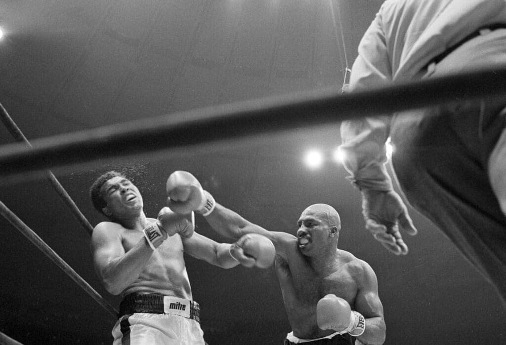 Challenger Earnie Shavers, right, follows through with a right against champion Muhammad Ali during the fourth round of their boxing bout in New York’s Madison Square Garden, Sept. 29, 1977. (AP Photo/Ron Frehm, File)