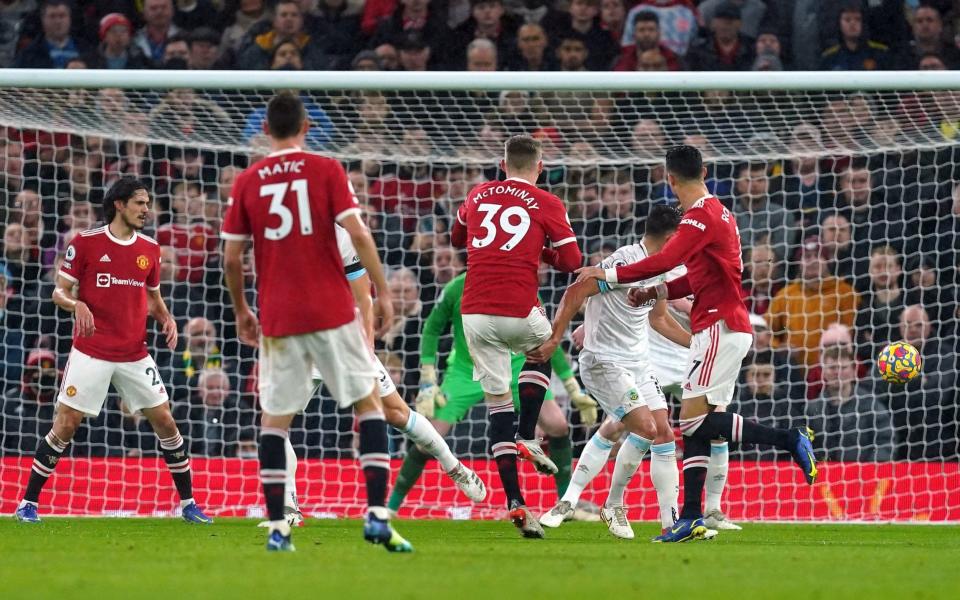 Manchester United's Scott McTominay (centre) scores their side's first goal of the game during the Premier League match at Old Trafford - Martin Rickett/PA Wire