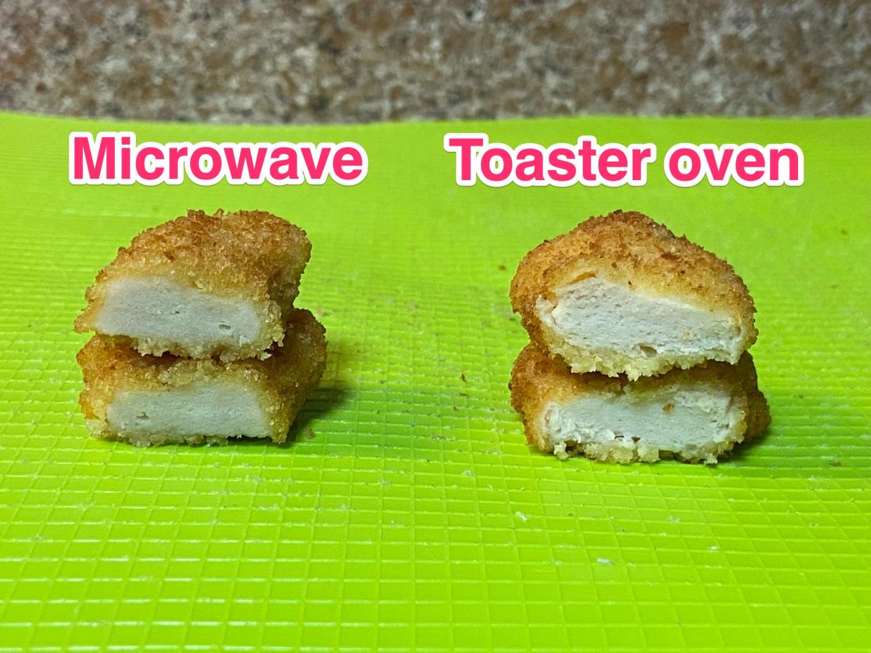 Side my side images of a microwaved chicken nugget cut in half and stacked showing the inner white meat next to another chicken nugget that was heated in a toaster oven. The microwave nugget meat looks more firm and almost grey and the toaster oven nugget looks thicker with more texture in the white meat.