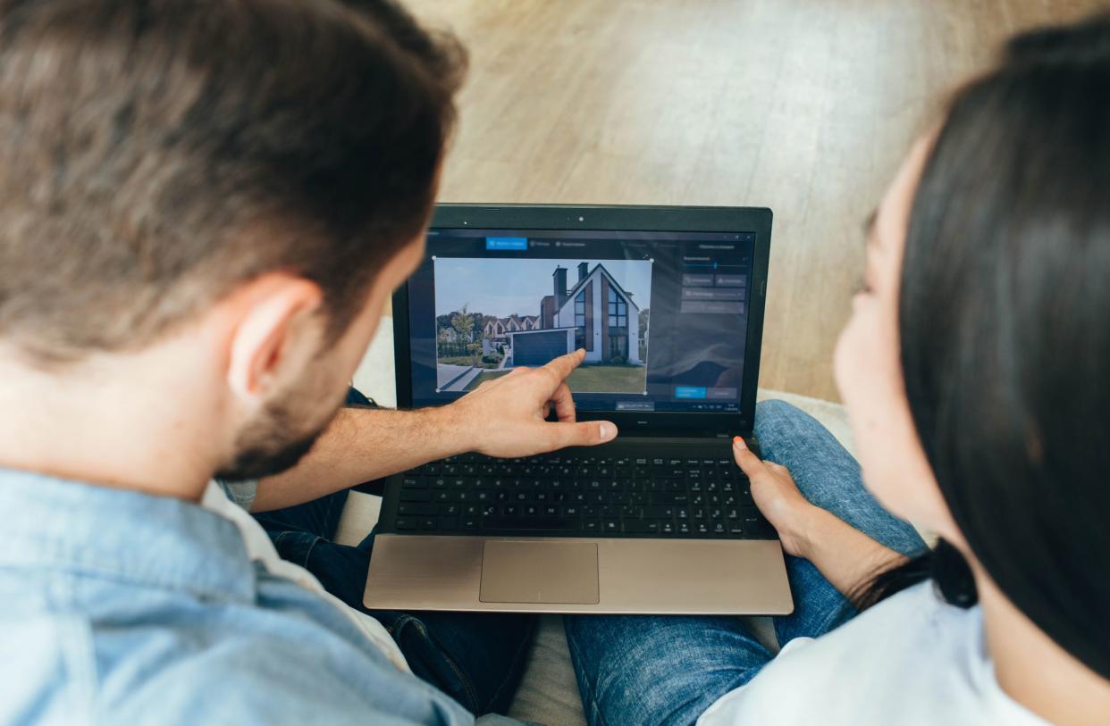 couple looking at house online