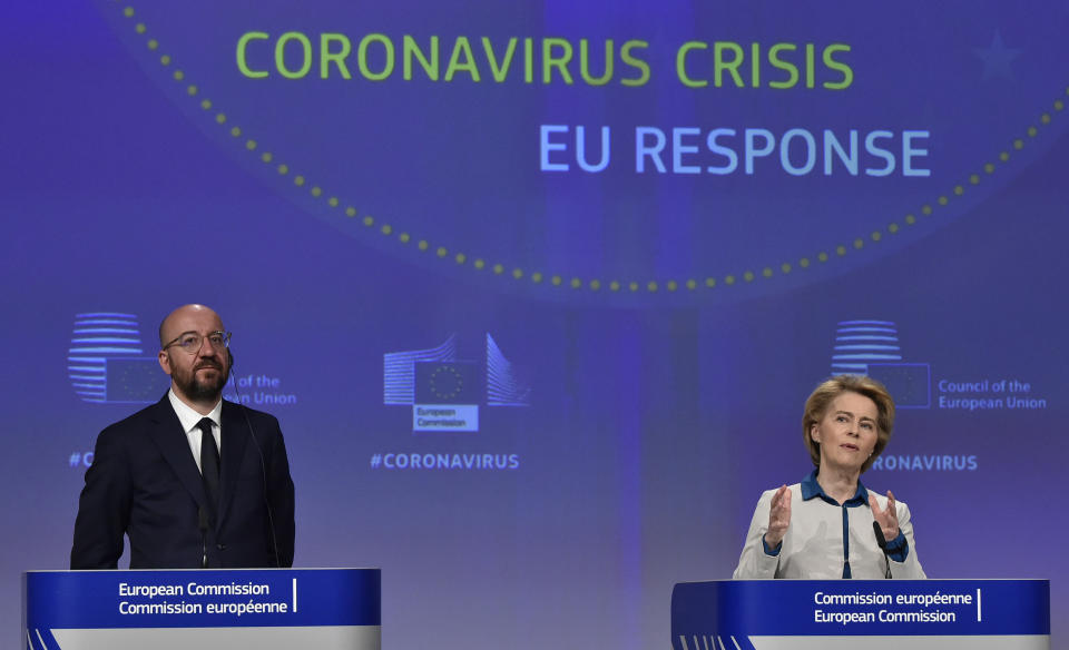 European Commission President Ursula von der Leyen, right, and European Council President Charles Michel participate in a media conference on the European Union response to the COVID-19 crisis at EU headquarters in Brussels, Wednesday, April 15, 2020. The European Union moved Wednesday to head off a chaotic and potentially disastrous easing of restrictions that are limiting the spread of the coronavirus, warning its 27 nations to move very cautiously as they return to normal life and base their actions on scientific advice. (John Thys, Pool Photo via AP)