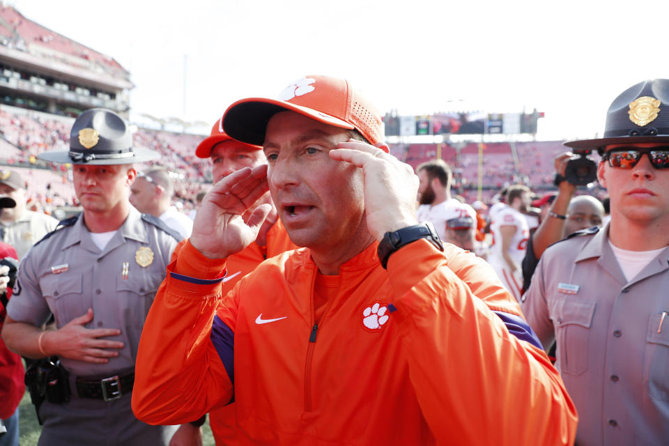 Clemson Tigers coach Dabo Swinney walks off the field after the game with the Louisville Cardinals at Cardinal Stadium. (USA Today)