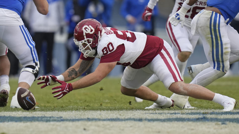 Oklahoma defensive lineman Rondell Bothroyd (80) dives on a fumble during the first half of an NCAA college football game against BYU, Saturday, Nov. 18, 2023, in Provo, Utah. (AP Photo/Rick Bowmer)