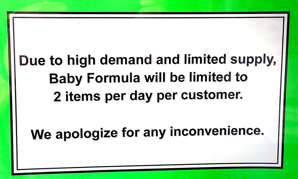 A sign on the door at Discount Drug Mart in Wooster shows how local stores are limiting the number of bottles and cans of baby formula per customer.