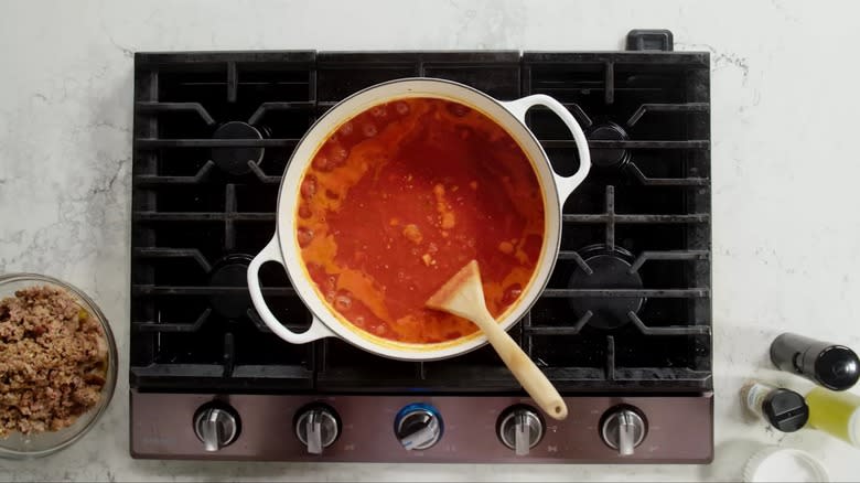 Lasagne sauce bubbling on stove