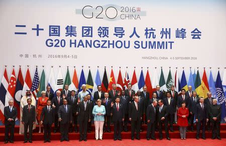 Leaders, including Britain's Prime Minister Theresa May (2nd row, 2nd L), pose for pictures during the G20 Summit in Hangzhou, Zhejiang province, China September 4, 2016. REUTERS/Damir Sagolj/File Photo