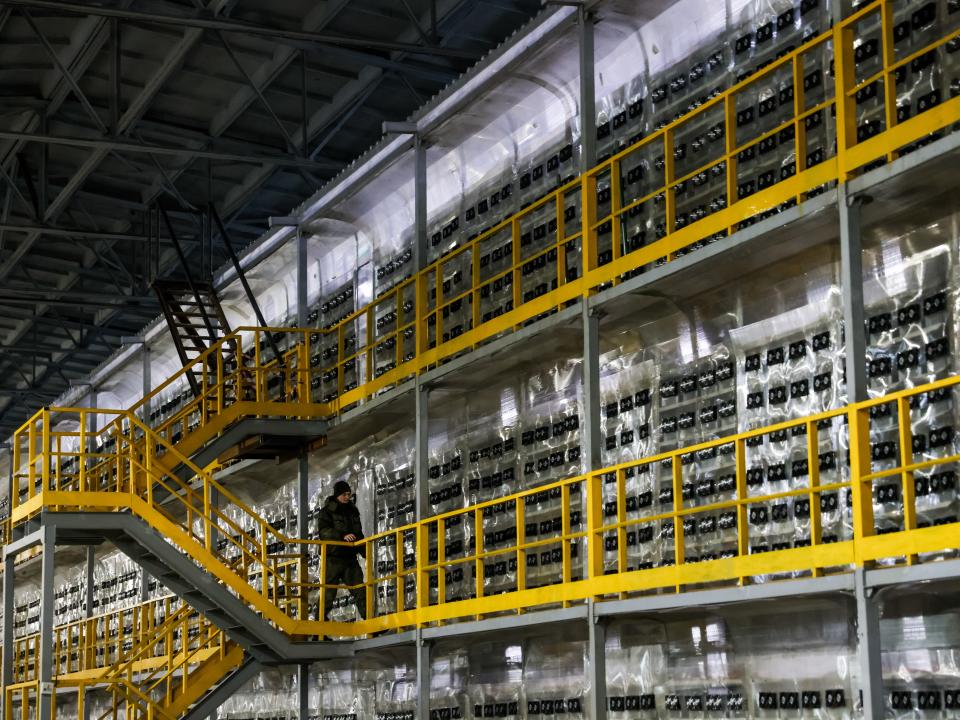 Security guard Viktor Kudinov patrols a server room of the BitRiver data centre in Bratsk, 460km north of Irkutsk.