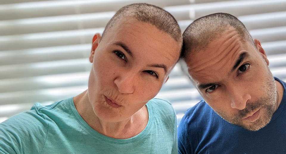 Melinda and her husband with shaved heads. Source: Supplied 