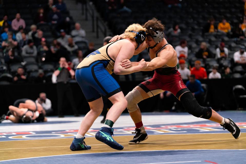 Rocky Mountain's Josh Stutzman starts his third-place match against Grandview's Charlie Herting at the Colorado state wrestling tournament at Ball Arena on Saturday.