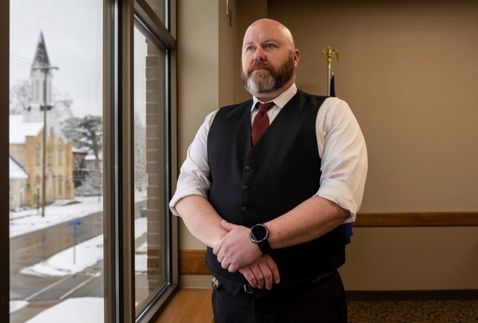 Phillip Hesche, 44, an Ionia County Sheriff's Office detective sergeant, stands in a room inside the Ionia County Courthouse on Thursday, Jan. 11, 2024. Hesche was the detective that showed up on the scene after Amedy Dewey was shot in the face. "It happened around January and it was dead dry cold, Hesche said. "I couldn't fathom what was so bad that he would shoot his wife in the face and then shoot his stepdaughter in the face and then turn the gun to himself and shoot himself."