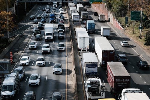 Cars and trucks on the Cross Bronx Expressway, known for heavy traffic and contributing to air pollution