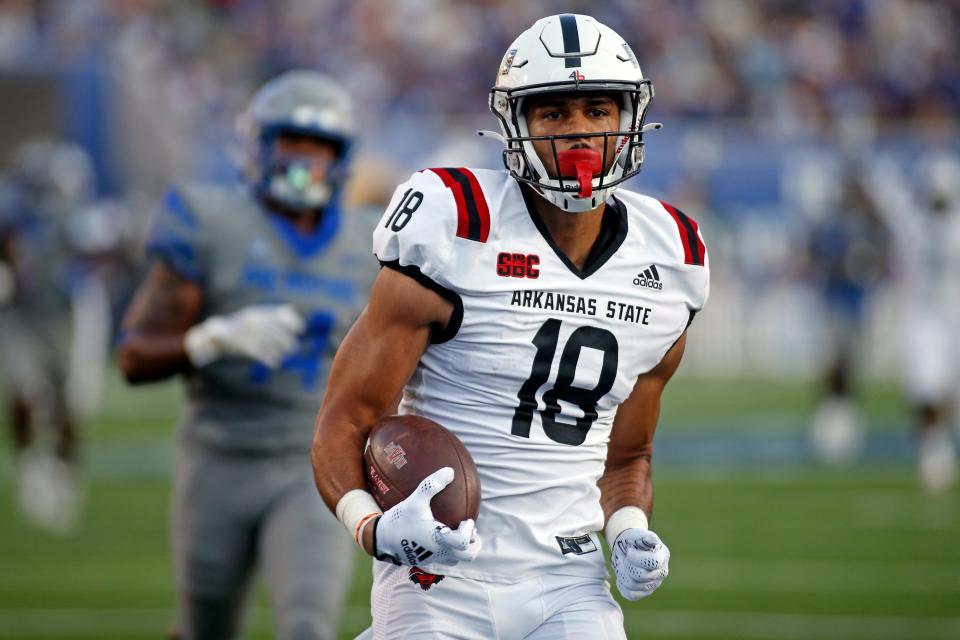 Sep 17, 2022; Memphis, Tennessee, USA; Arkansas State Red Wolves tight end Seydou Traore (18) runs after catch for a touchdown during the first half against the Memphis Tigers at Liberty Bowl Memorial Stadium. Mandatory Credit: Petre Thomas-USA TODAY Sports