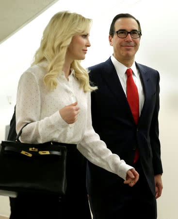 FILE PHOTO: U.S. Treasury Secretary Steven Mnuchin arrives with his fiance Louise Linton at hearing on Domestic and International Policy Update before the Senate Banking Committee on Capitol Hill in Washington, DC, U.S. May 18, 2017. REUTERS/Yuri Gripas/File Photo