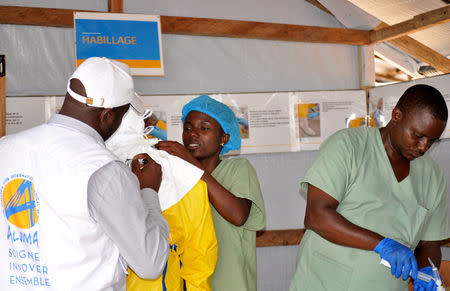 Medical team wear protective suits as they prepare to administer Ebola patient care at The Alliance for International Medical Action (ALIMA) treatment center in Beni, North Kivu province of the Democratic Republic of Congo September 6, 2018. REUTERS/Fiston Mahamba