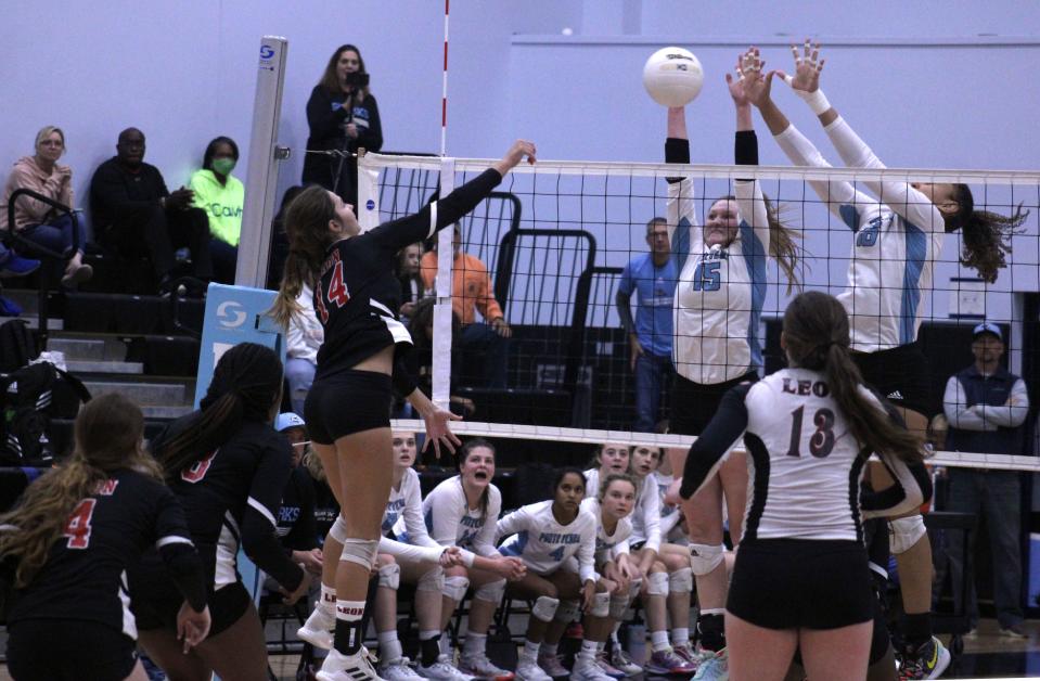 Ponte Vedra's Jessica Shattles (15) and Zeta Washington (16) attempt to block a hit by Leon's Sophie Beckham (14) in the FHSAA Region 1-6A high school volleyball final on November 6, 2021. [Clayton Freeman/Florida Times-Union]