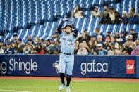 Toronto Blue Jays' George Springer (4) celebrates after singling a ground ball during first-inning baseball game action against the Boston Red Sox in Toronto, Monday, April 25, 2022. (Christopher Katsarov/The Canadian Press via AP)