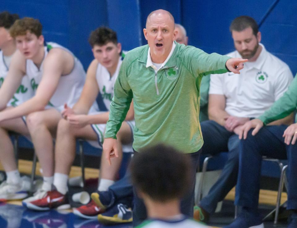 Peoria Notre Dame head coach Tom Lacher coaches his team against Manual late in the second half of their boys basketball game Friday, Dec. 2, 2023 at PND High School. The Rams defeated the Irish 46-43.