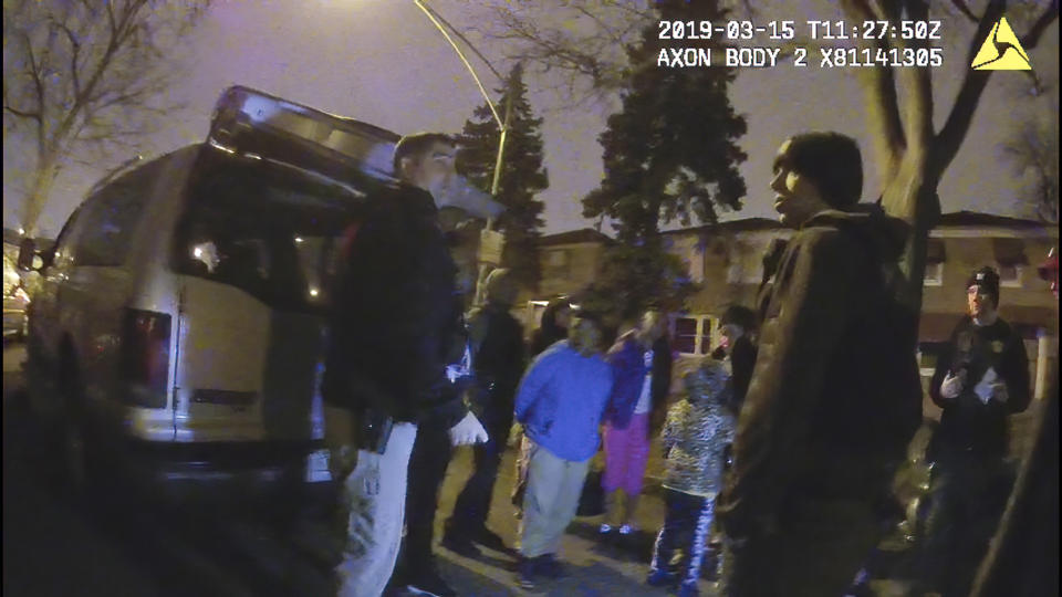 This image provided by the Chicago Police Department shows an image from video from a police worn body camera on March 15, 2019, in Chicago. Royal Smart, 8, in blue was handcuffed by police in south Chicago. Police were looking for illegal weapons and found none. No one was arrested. (Chicago Police Department via AP)