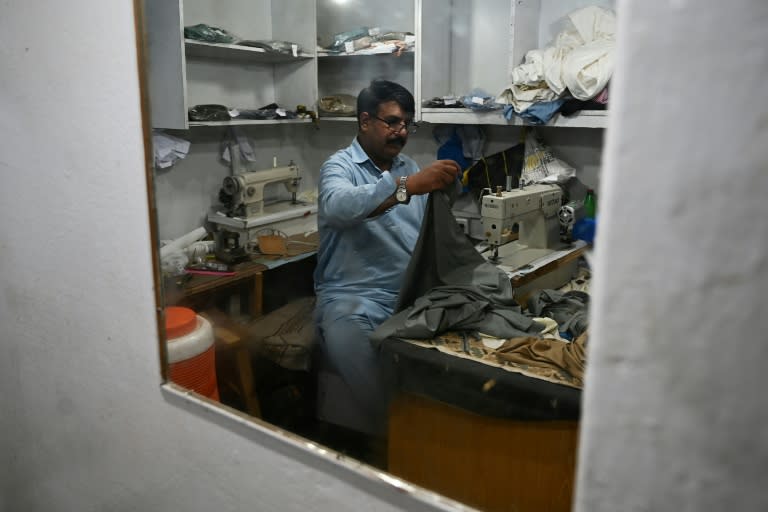 Muhammad Razzaq said two armed men barged into his Islamabad store before making off with 240 completed or near-finished shalwar kameez outfits (AFP/Aamir QURESHI)